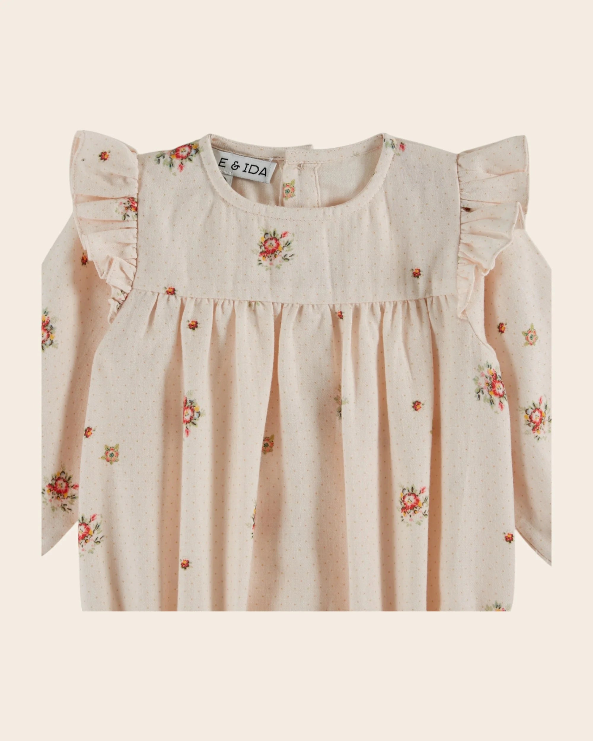 Pale pink flowers romper